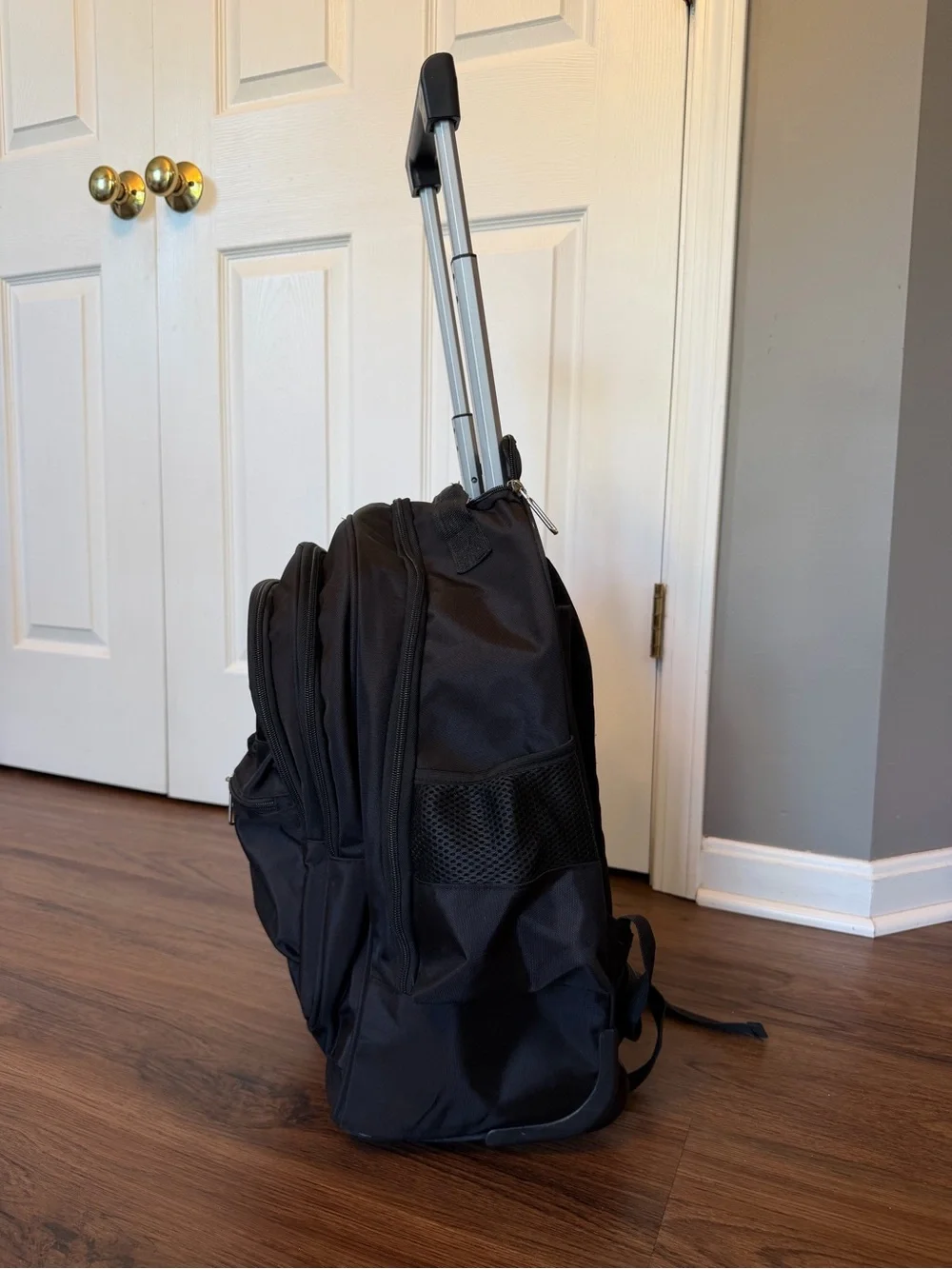 Black Everyday Rolling Travel Backpack with Multiple Pockets